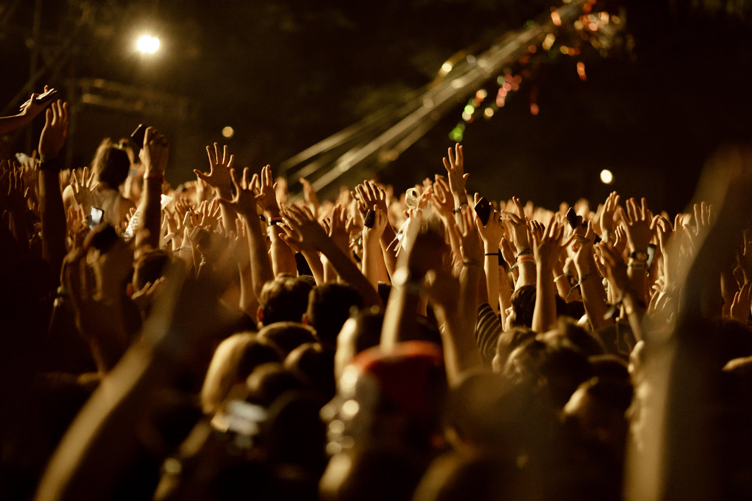 large-group-fans-with-arms-raised-having-fun-music-concert-night large-group-fans-with-arms-raised-having-fun-music-concert-night